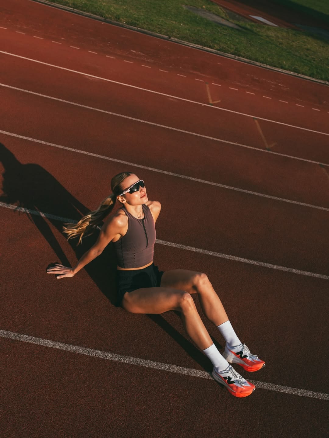 Athlete resting on a running track