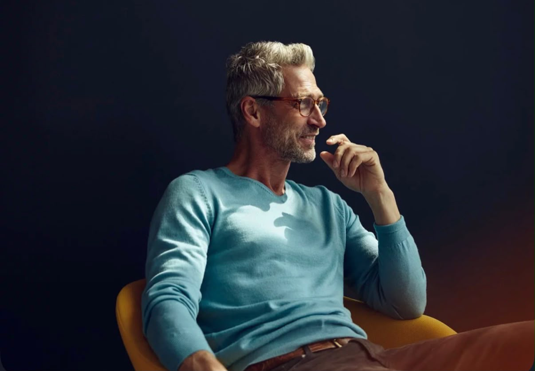 Founder taking a thoughtful pause, seated